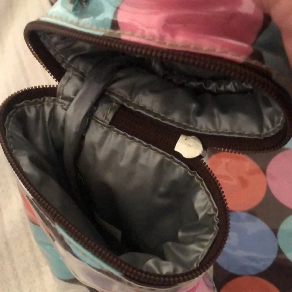 Multi colored easy wipe pokadot kalencom diaper bag